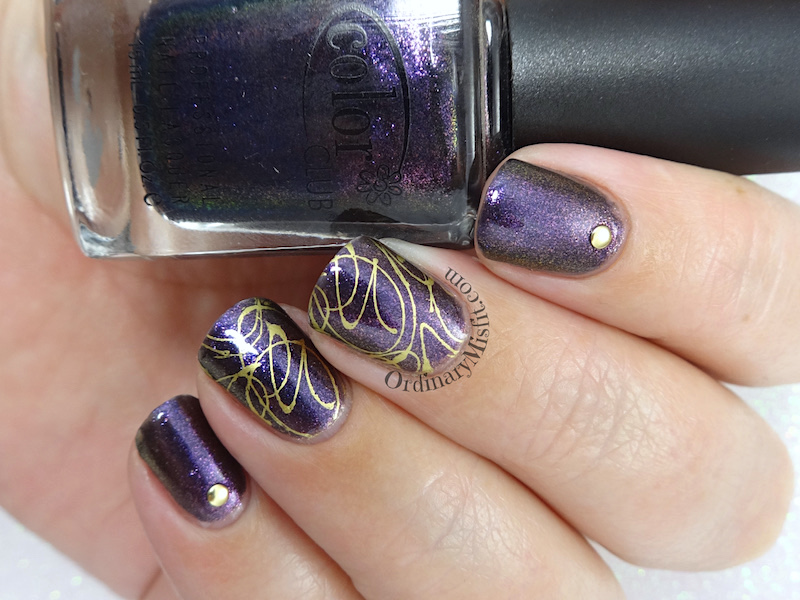 Purple and gold squiggles nail art