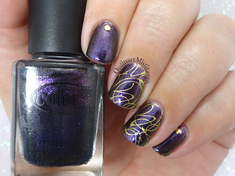 Purple and gold squiggles nail art